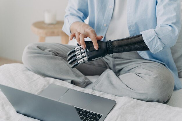 A person setting up the Sleep Number i10 smart bed, attaching the air hoses to the mattress. The focus is on the ease of assembly and the quality of the components.