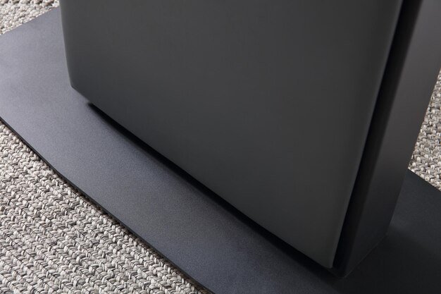 A detailed close-up of the Samsung QN900D's bezel-less design, highlighting the minimalist aesthetic and premium build quality, with a focus on the thinness of the frame and the seamless integration of the screen into the surrounding environment.