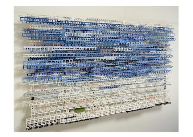A shot of the Samsung QN900D's back panel, showcasing the clean cable management system and the slim One Connect box that minimizes clutter, highlighting the TV's ability to maintain a tidy and organized entertainment setup.