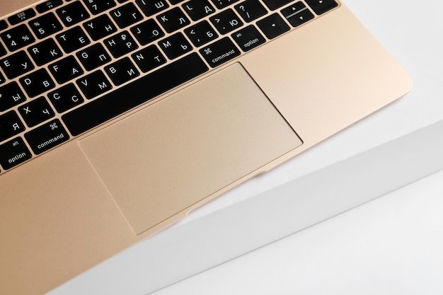 A close-up shot of the MacBook Air M4's keyboard and trackpad, emphasizing the sleek design and comfortable typing experience. The lighting highlights the aluminum finish and the precision of the components.