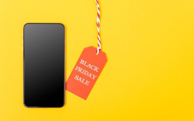 A close-up of a price tag overlaid with a notification icon indicating a price drop, alongside a laptop displaying a shopping cart with highlighted customer reviews. The image should convey the importance of staying updated on pricing and user feedback.