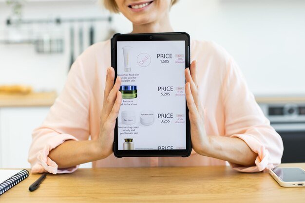 A close-up of a person reading a buying guide on a tablet, with different product options displayed.