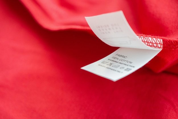 A close-up shot of a clearance tag on a clothing item in a department store, clearly displaying a 