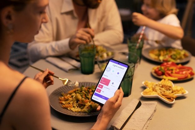 A close-up shot of a smartphone screen displaying a restaurant's loyalty program app. The app shows accumulated points, available rewards, and a clear call to action to redeem points for a discount. The background is blurred to highlight the app's interface and its potential for saving money.